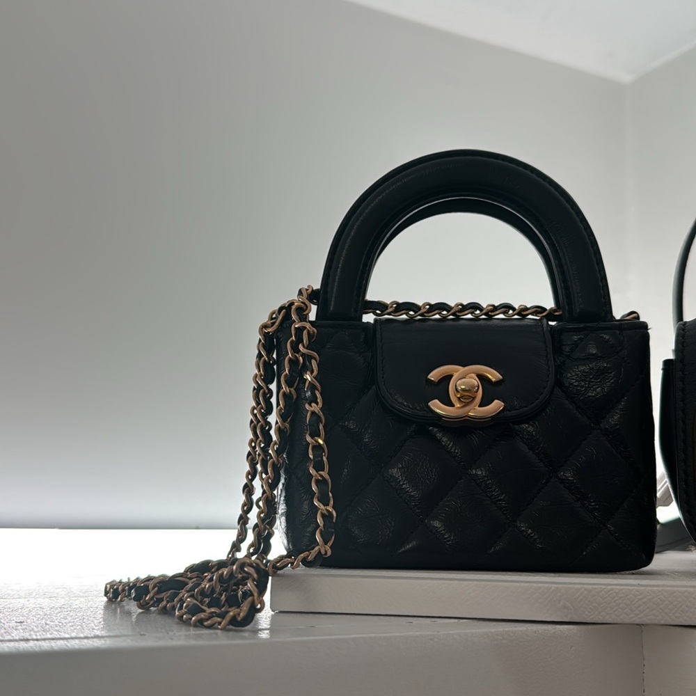 SOLD CHANEL Black Mini Bag with Gold Accents